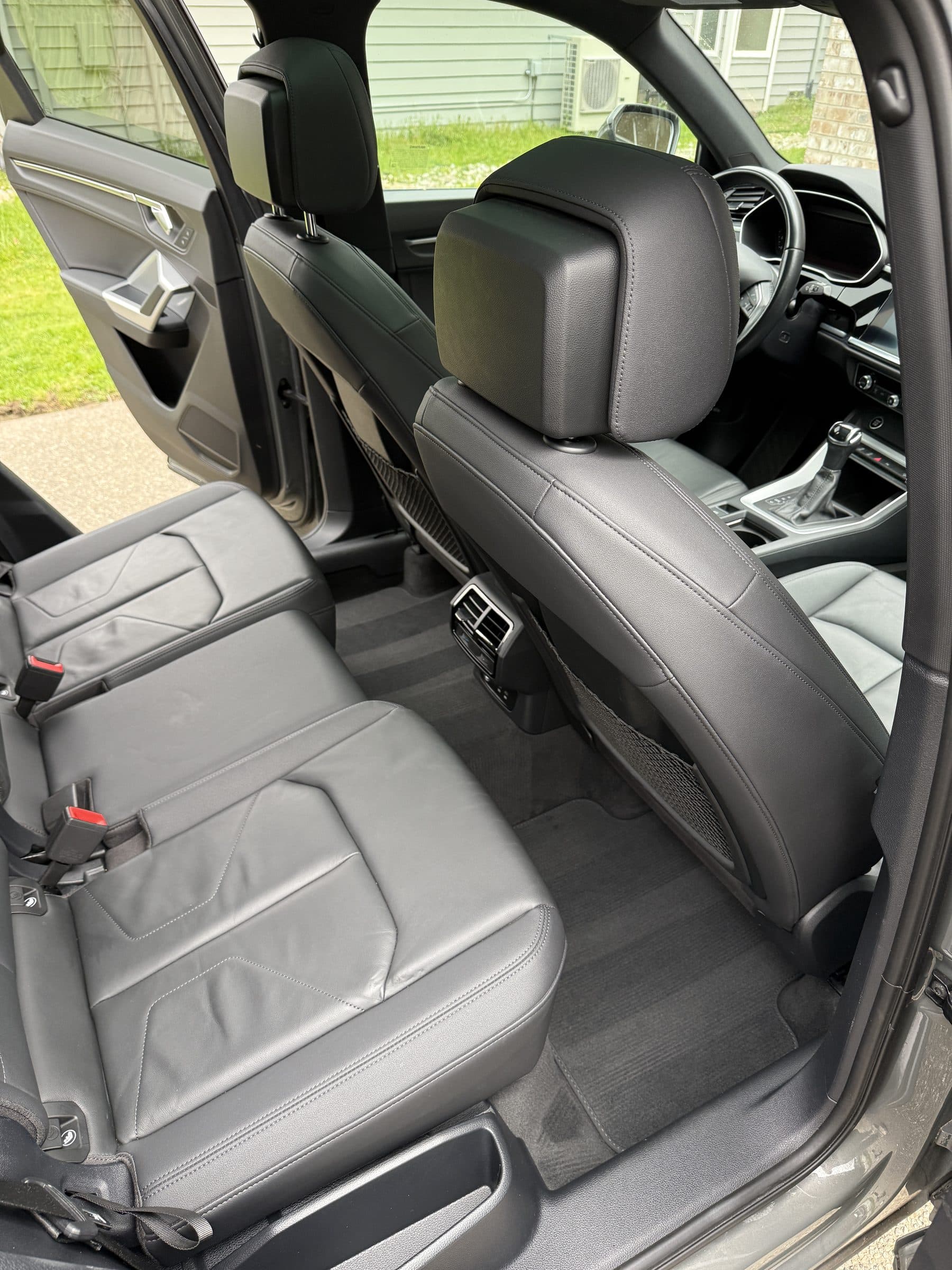 Audi Q3 front leather seats cleaned and conditioned during an interior detail