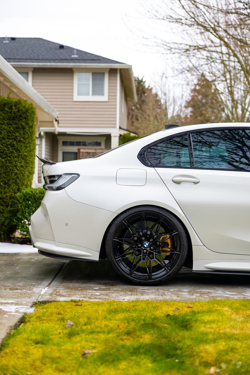 Glossy side profile of a detailed white BMW M3