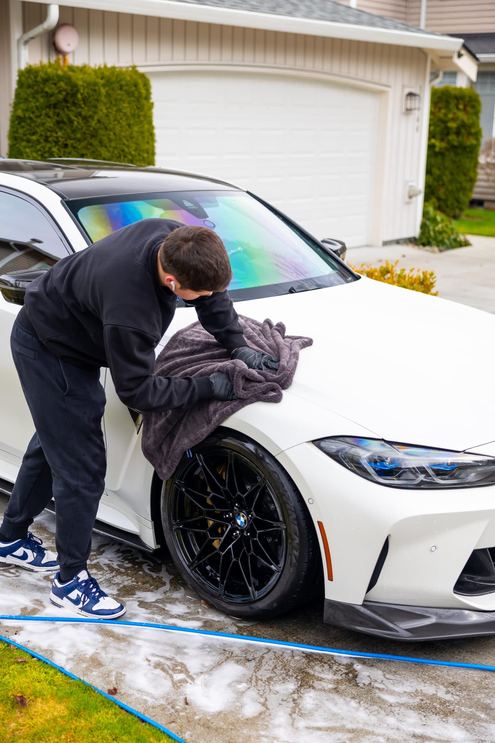 BMW M3 being hand dried after a mobile hand wash