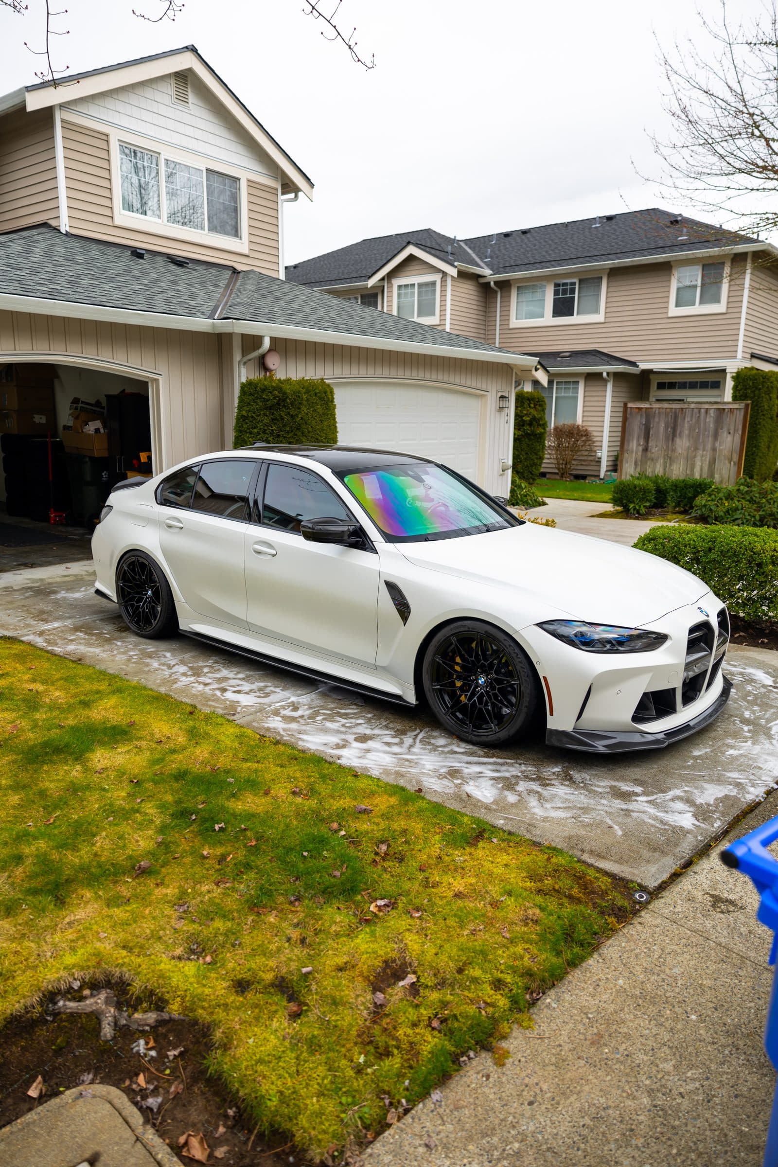 White BMW M3 in a home driveway after a mobile detail by Refined Auto Detailing