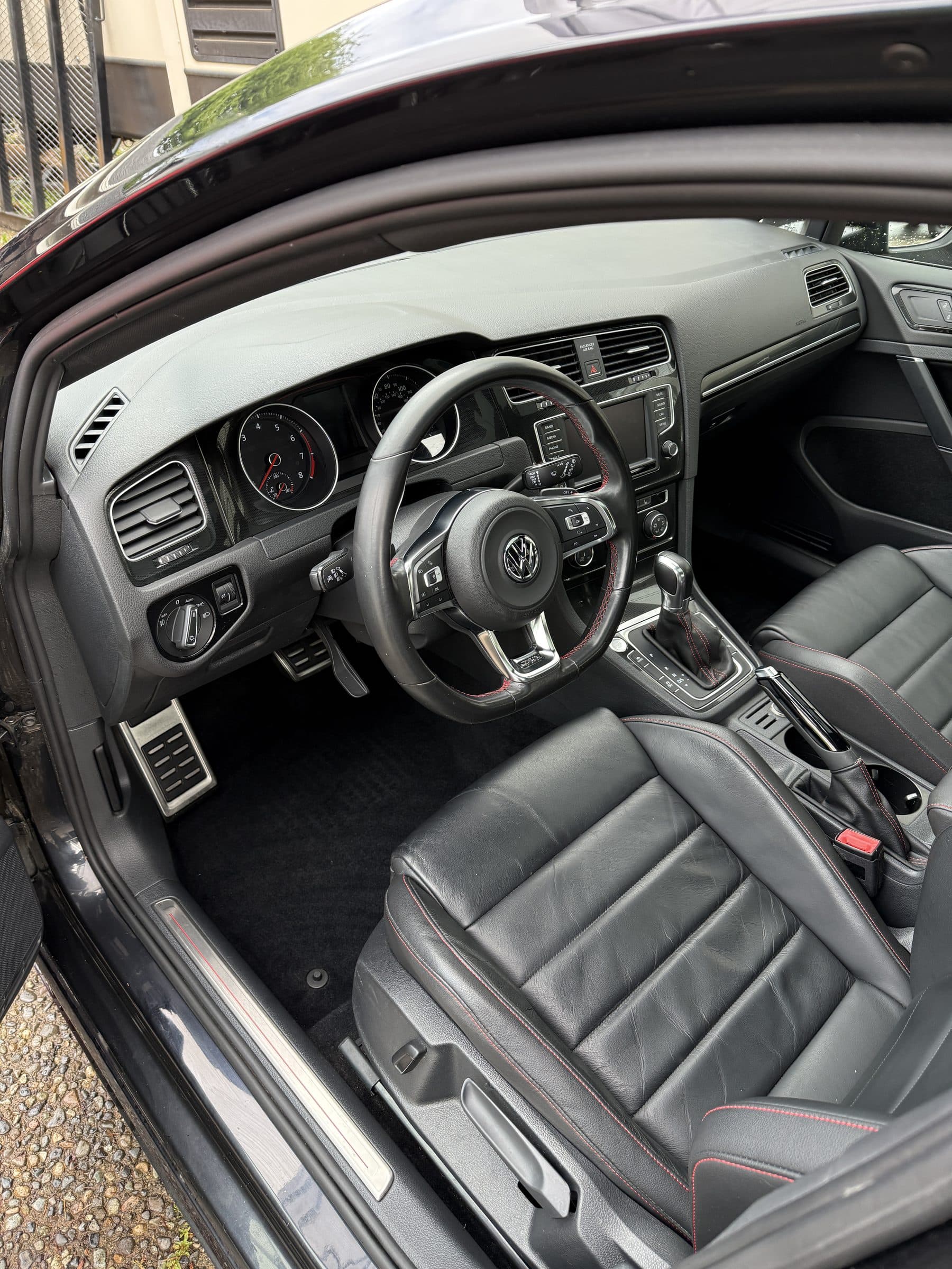 Volkswagen GTI interior after an interior detail, with clean floors and leather seats